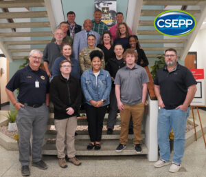 L-105 Class Participants in group photo standing on stairs in SEOC